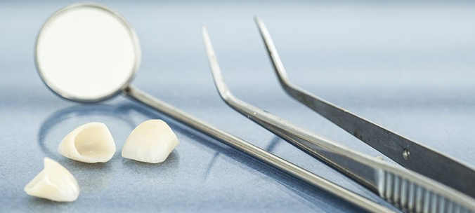 A dental mirror and curved forceps