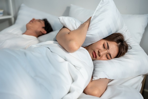 woman frustrated on partner with sleep apnoea