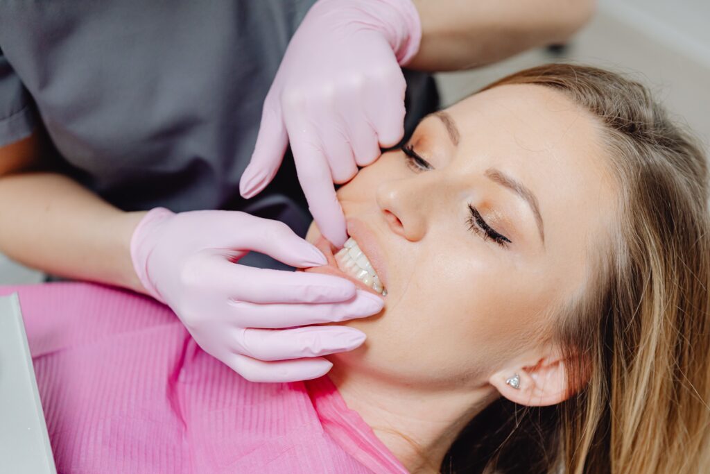 dentist checking patients receding gums